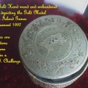 Island Games Gold Medal round lid ajar